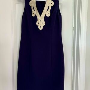 Navy blue Vince Camuto sheath dress with embroidered detail in gills